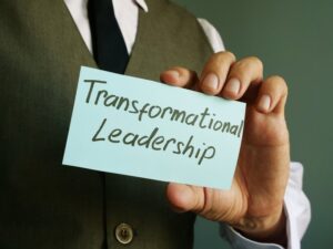 Transformational Leadership Sign On A Black Page.